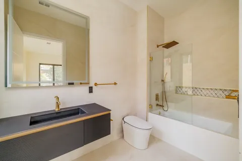 Bathroom with floating vanity and glass shower