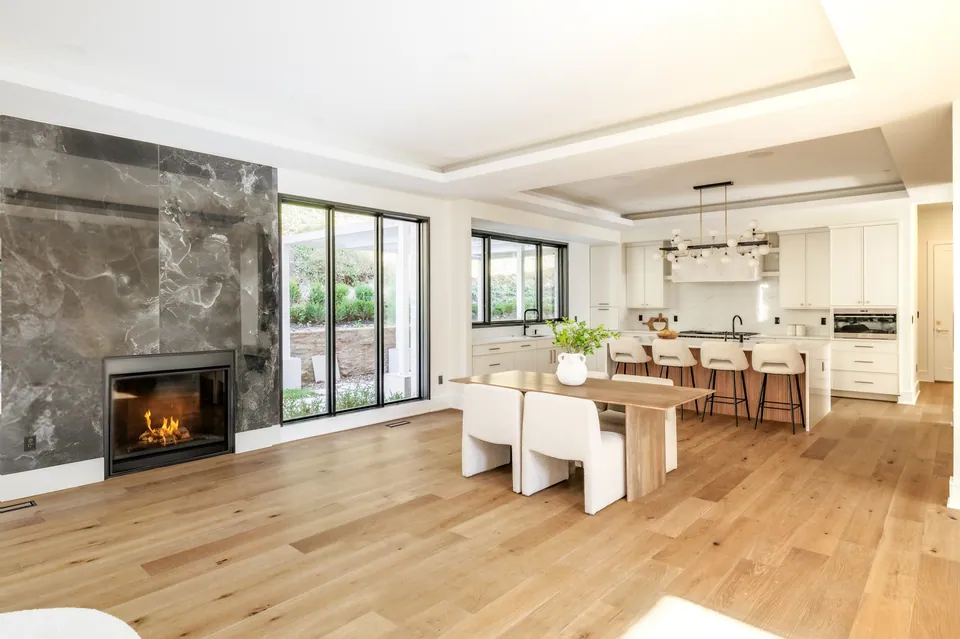 Family room fireplace with the kitchen beyond
